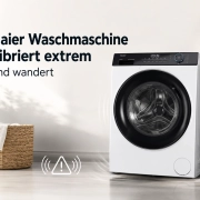 Eine Haier Waschmaschine in einem hellen Raum mit einem Wäschekorb daneben